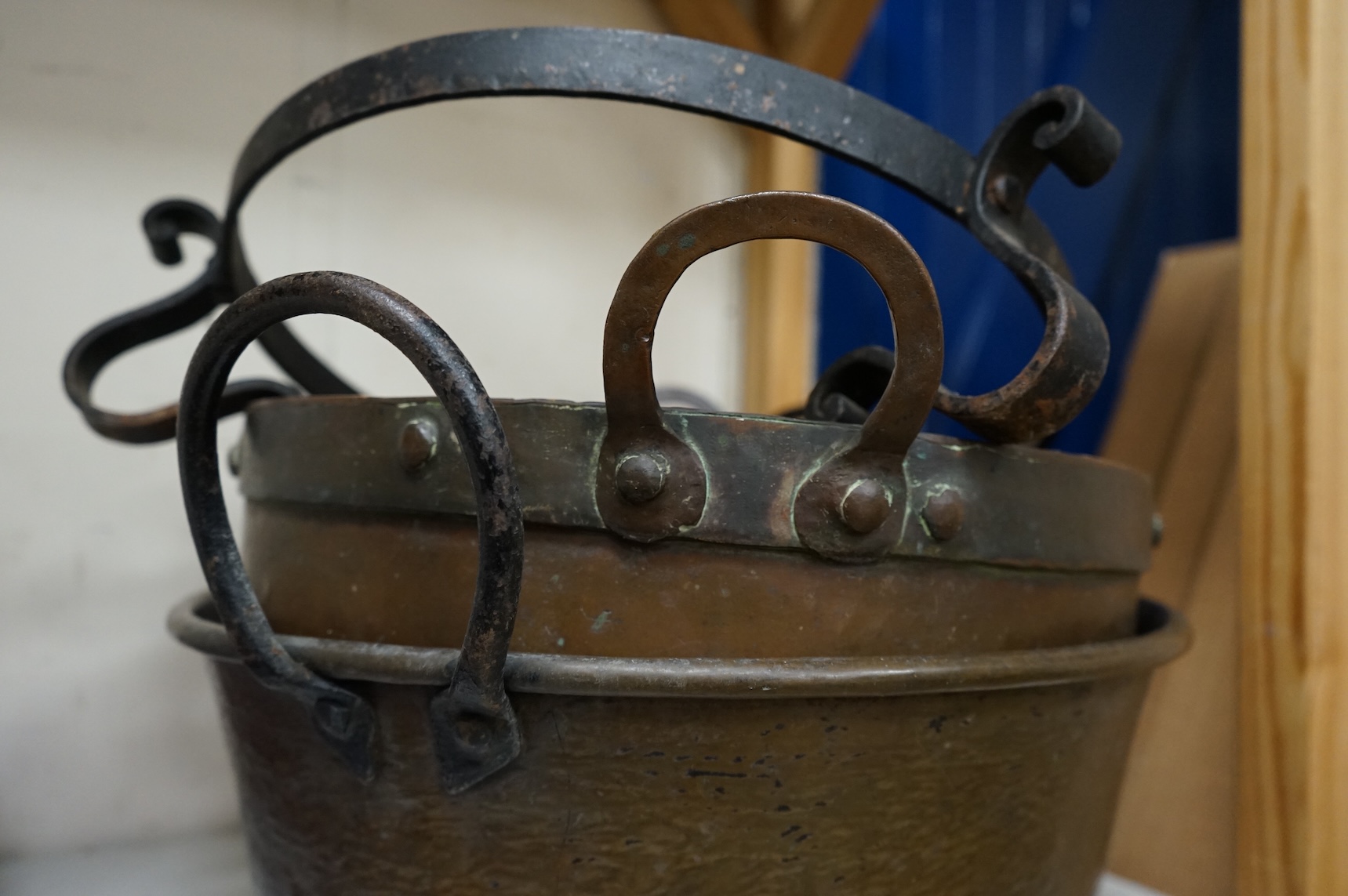 Four copper pans and a copper warming vessel